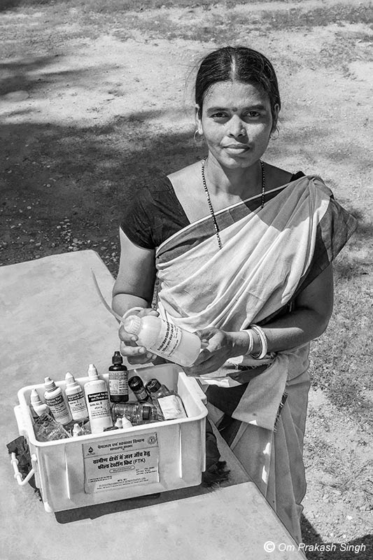 Jal Sahiya - a grassroots-level woman volunteer under Jal Jeevan Mission showing her ‘Field Test Kit’ for testing water quality Jharkhand, India